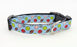 All-Star Sports Ball dog collar featuring baseball, basketball, football, soccer, tennis, and volleyball on a light blue ribbon with a black plastic buckle.