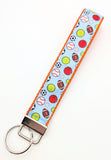 Matching All-Star Sports Ball ribbon key fob wristlet keychain in the light blue multi-sport ball pattern.