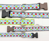 A lineup of multiple All-Star Sports Ball dog collars showing the light blue multi-sport ribbon on different colored nylon webbing bases.