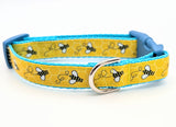 Small dog collar featuring bumblebee print ribbon with side-release buckle and D-ring
