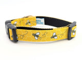 Extra small dog collar with yellow and black bumblebee patterned ribbon on durable webbing