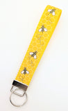 Matching yellow and black bumblebee ribbon fabric wristlet key fob keychain