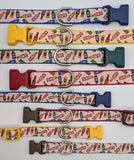 Set of dog collars with colorful bottle pattern and various buckles on a white background