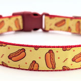 Medium dog collar featuring illustrated hotdogs and red details on sunny yellow ribbon with sturdy webbing backing