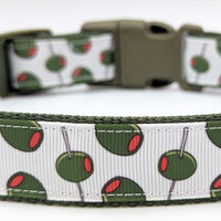 olive dog collar with green olives on a white background. Collar has an olive green buckle and nylon webbing