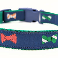 navy blue dog collar with little bow ties in green, white, red, orange, and blue