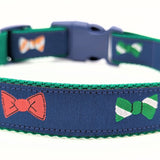 navy blue dog collar with little bow ties in green, white, red, orange, and blue