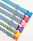 A collection of Spring Bunny Floral dog collars in various widths from 5/8 inch to 1 inch, showing the rabbit pattern scale.