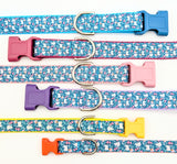 A collection of Spring Bunny Floral dog collars in various widths from 5/8 inch to 1 inch, showing the rabbit pattern scale.