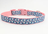 Handmade Spring Bunny Floral dog collar featuring white rabbits and flowers on a dark turquoise background with a side-release buckle.