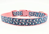 Handmade Spring Bunny Floral dog collar featuring white rabbits and flowers on a dark turquoise background with a side-release buckle.