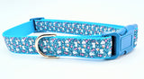 Handmade Spring Bunny Floral dog collar featuring white rabbits and flowers on a dark turquoise background with a side-release buckle.