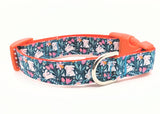 Handmade Spring Bunny Floral dog collar featuring white rabbits and flowers on a dark turquoise background with a side-release buckle.
