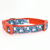 Handmade Spring Bunny Floral dog collar featuring white rabbits and flowers on a dark turquoise background with a side-release buckle.