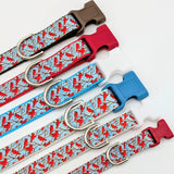 Group of Winter Cardinal dog collars in various widths, including 5/8 inch and 1 inch sizes, showing the cardinal bird pattern scale.