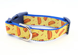 Small dog collar with yellow novelty hotdog ribbon and red accents, black side-release buckle, and metal D-ring