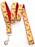 Matching dog leash featuring yellow hotdog and red accent ribbon with a heavy-duty swivel bolt snap hook
