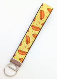 Matching wristlet key fob keychain made with yellow hotdog print ribbon and red accents