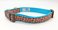 Large candy cookie dog collar in 1" width turquoise nylon and brown plastic hardware. Including a white label inside with Rogue Collars logo on it.